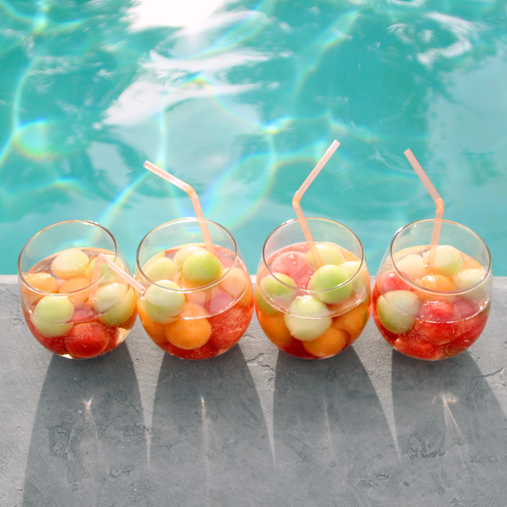 sparkling sangria with melon, poolside