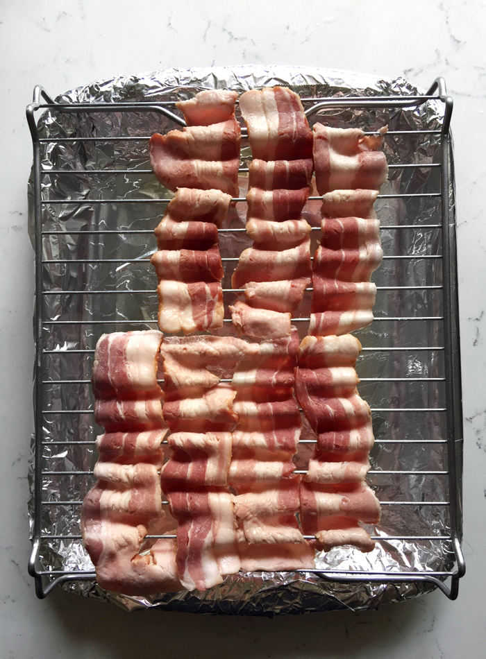 wavy cooked bacon on baking rack