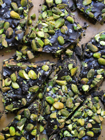 dark chocolate bark with pistachios sea salt on wooden board