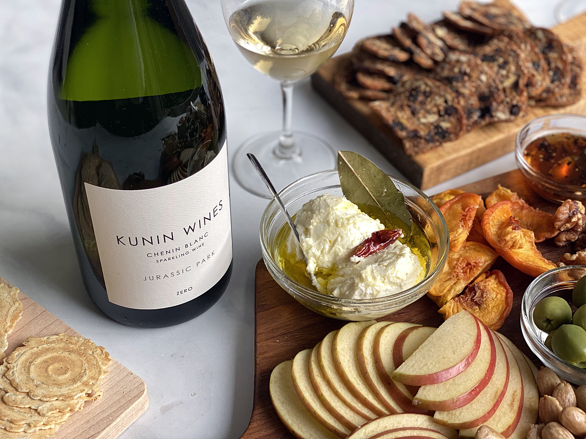 Kunin Wines chenin blanc wine bottle next to cheese board