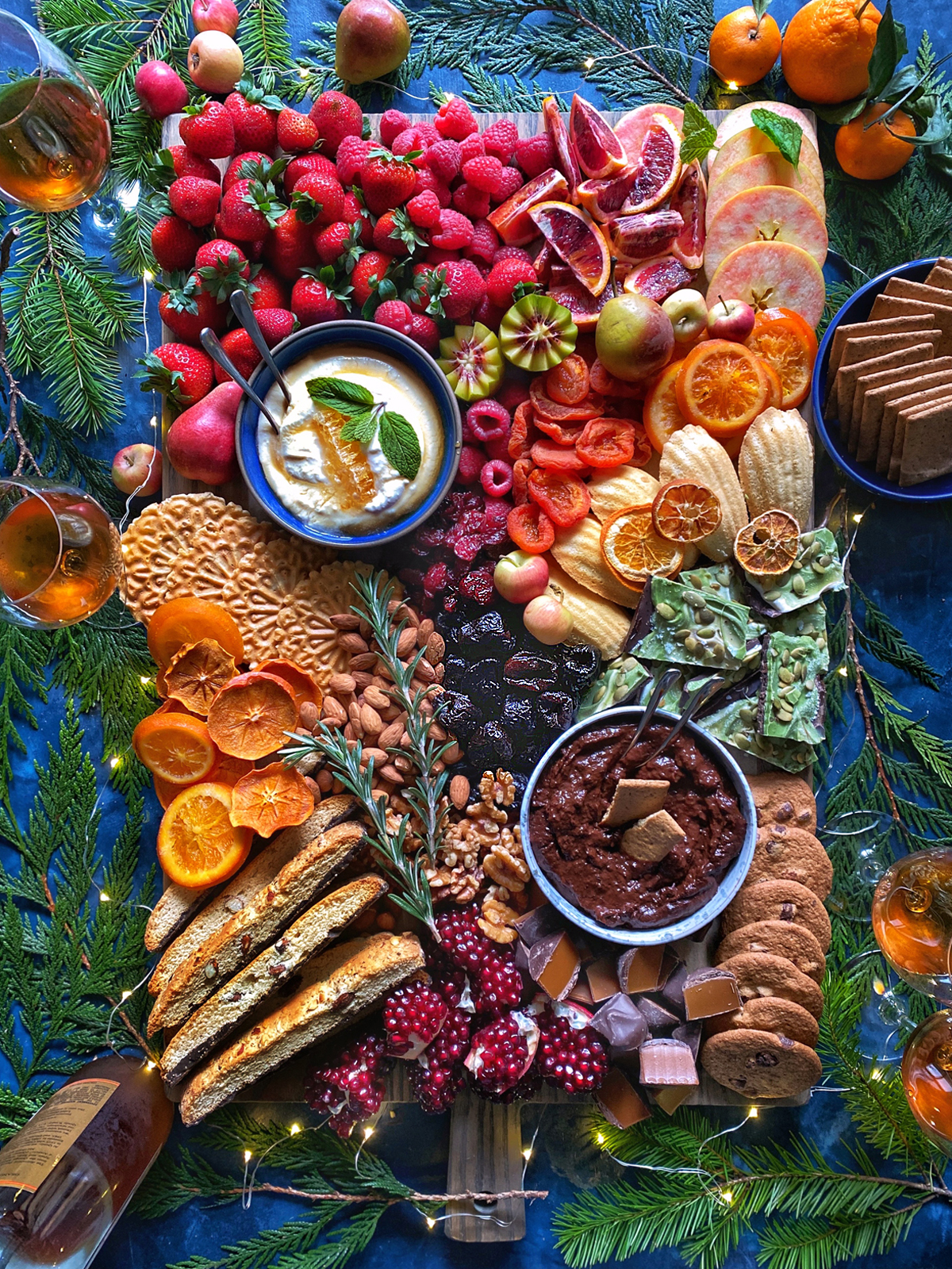 Dessert Charcuterie Board with fresh fruit, dips, and cookies