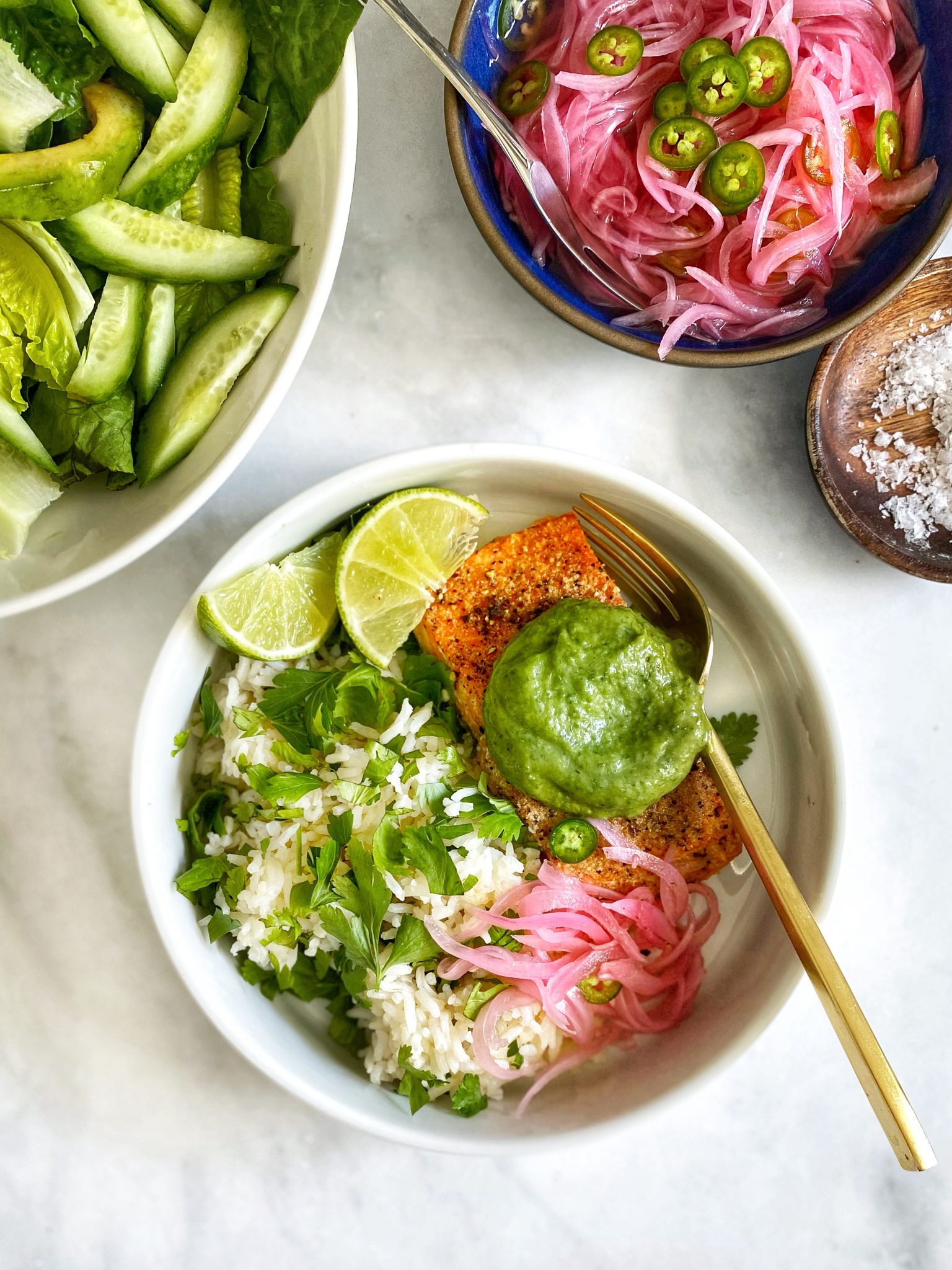 aji verde green sauce on peruvian roast salmon in rice bowl