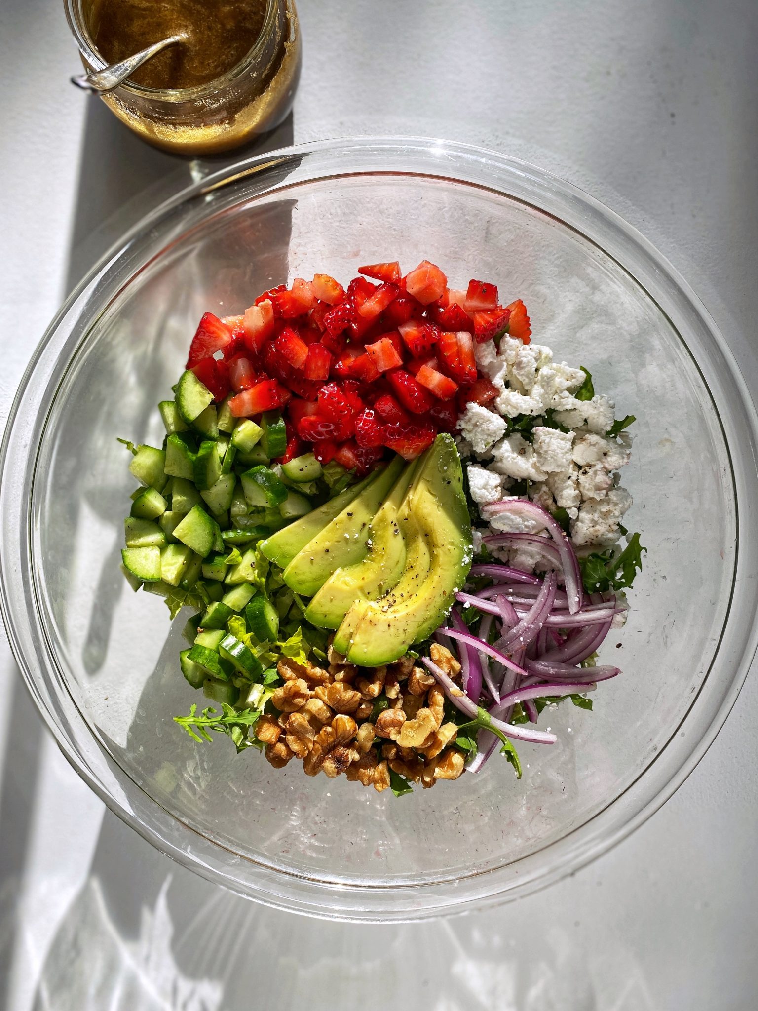 Strawberry salad with balsamic vinaigrette, chopped salad in salad bowl