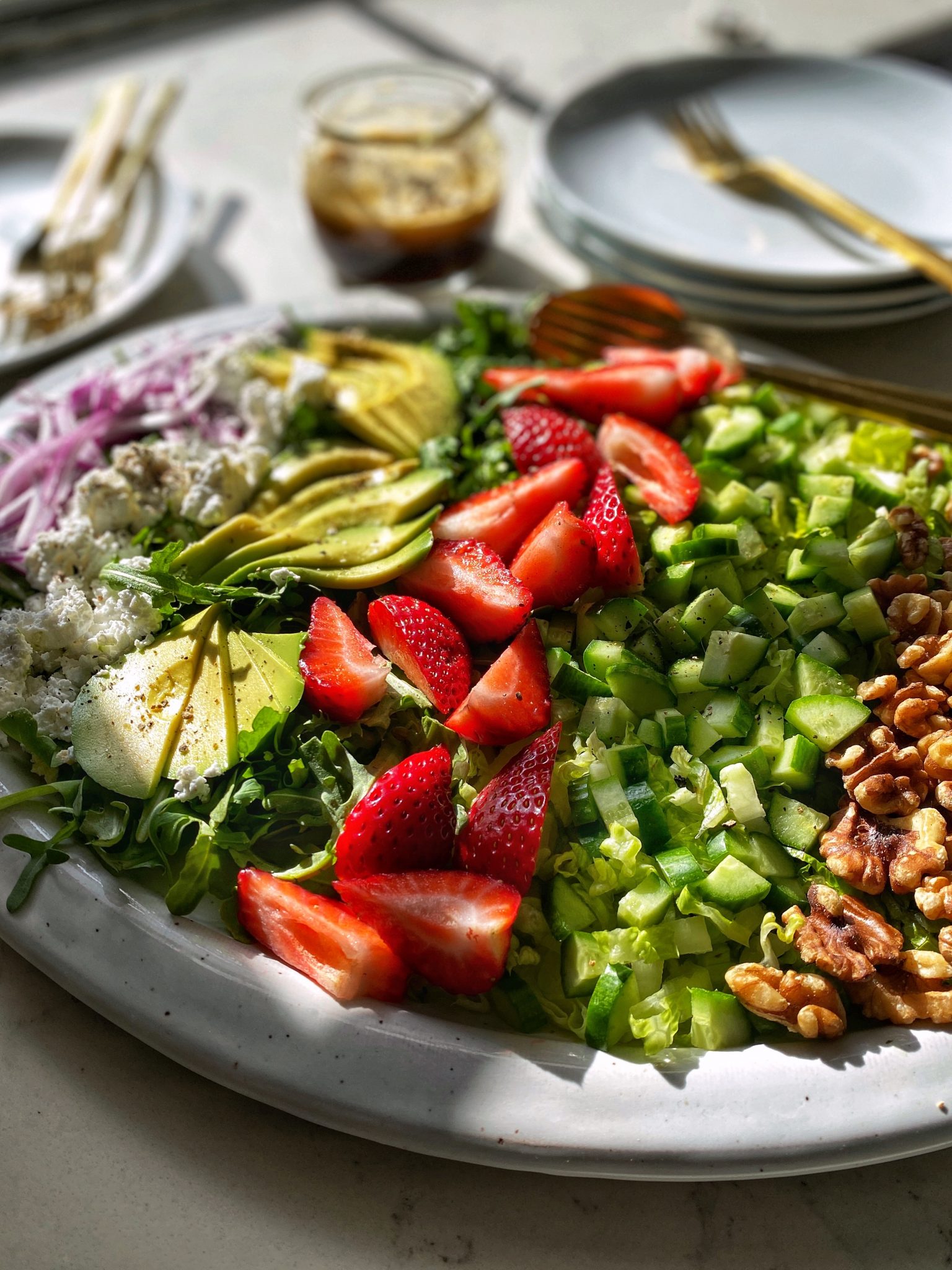 strawberry salad with arugula, feta, avocado and balsamic vinaigrette