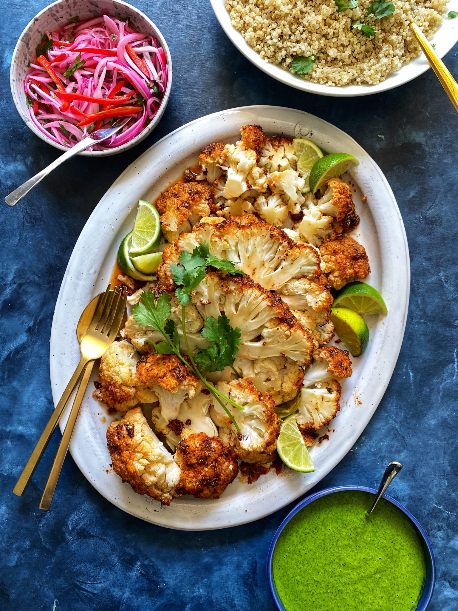 whole roasted cauliflower head, sliced on platter, peruvian pollo a la brasa marinade