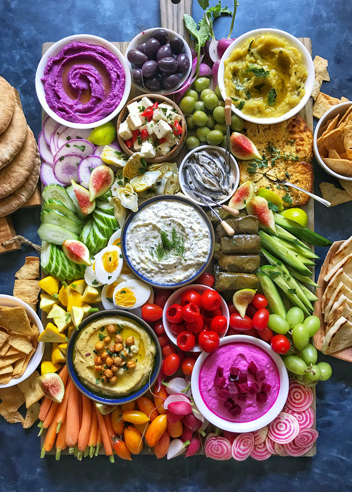 Mediterranean mezze platter with dips in bowls