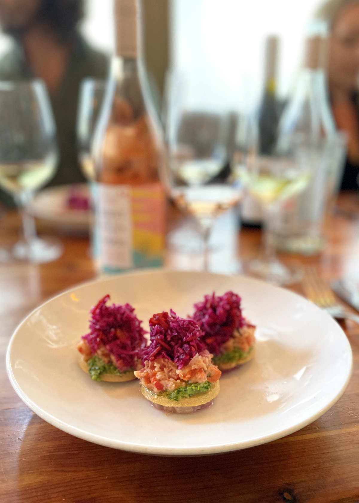 salmon ceviche tostadas with pickled purple cabbage paired with rose wine