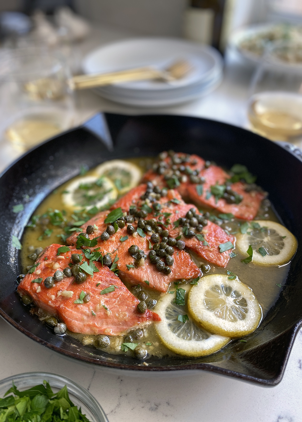 lemon caper salmon in cast iron skillet