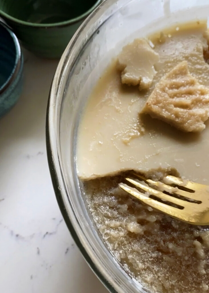 removing fat layer from gelled bone broth in bowl