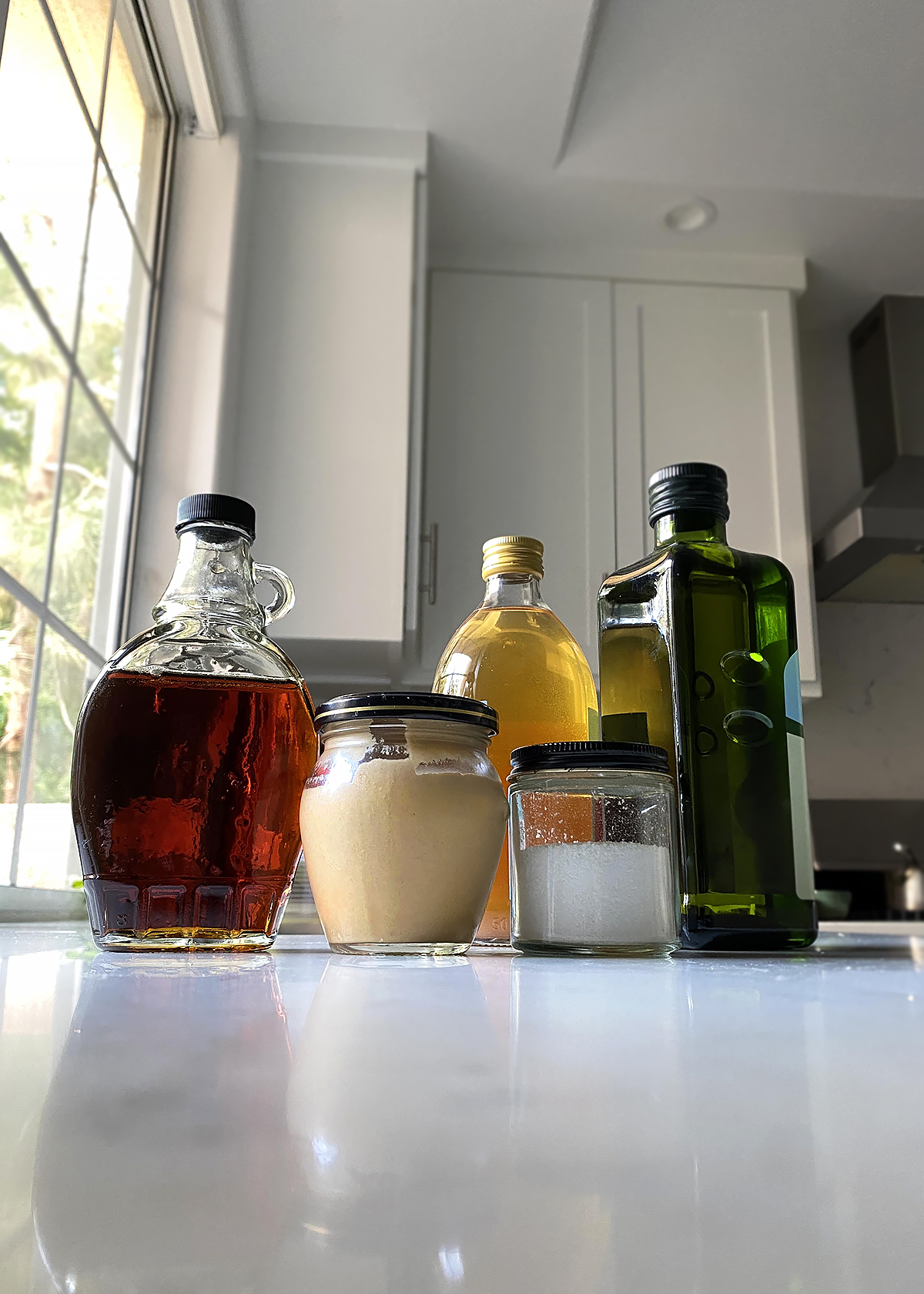 maple syrup, mustard, apple cider vinegar, olive oil bottles for maple mustard dressing