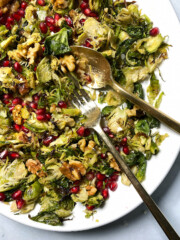 shredded brussels sprouts salad with pomegranate and walnuts