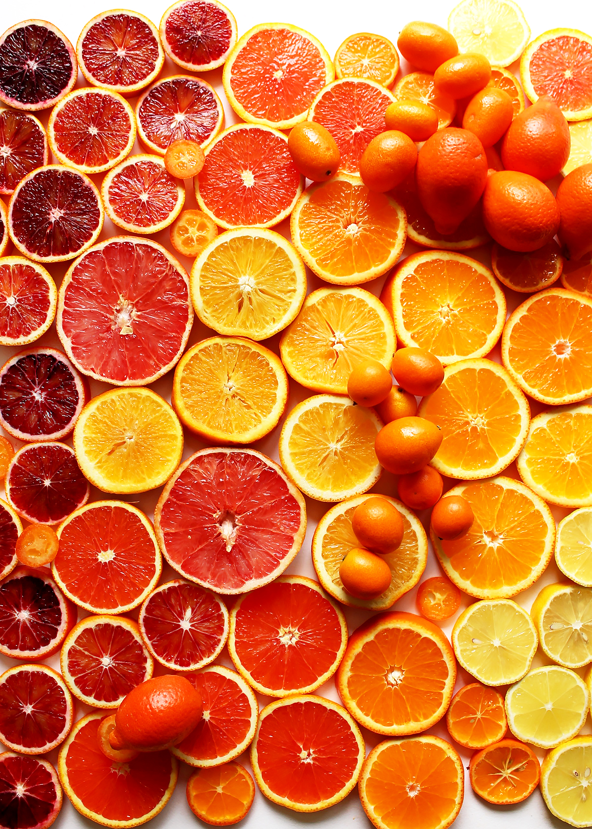 sliced citrus varieties: cara cara, navel, valnecia, blood oranges, kumquats