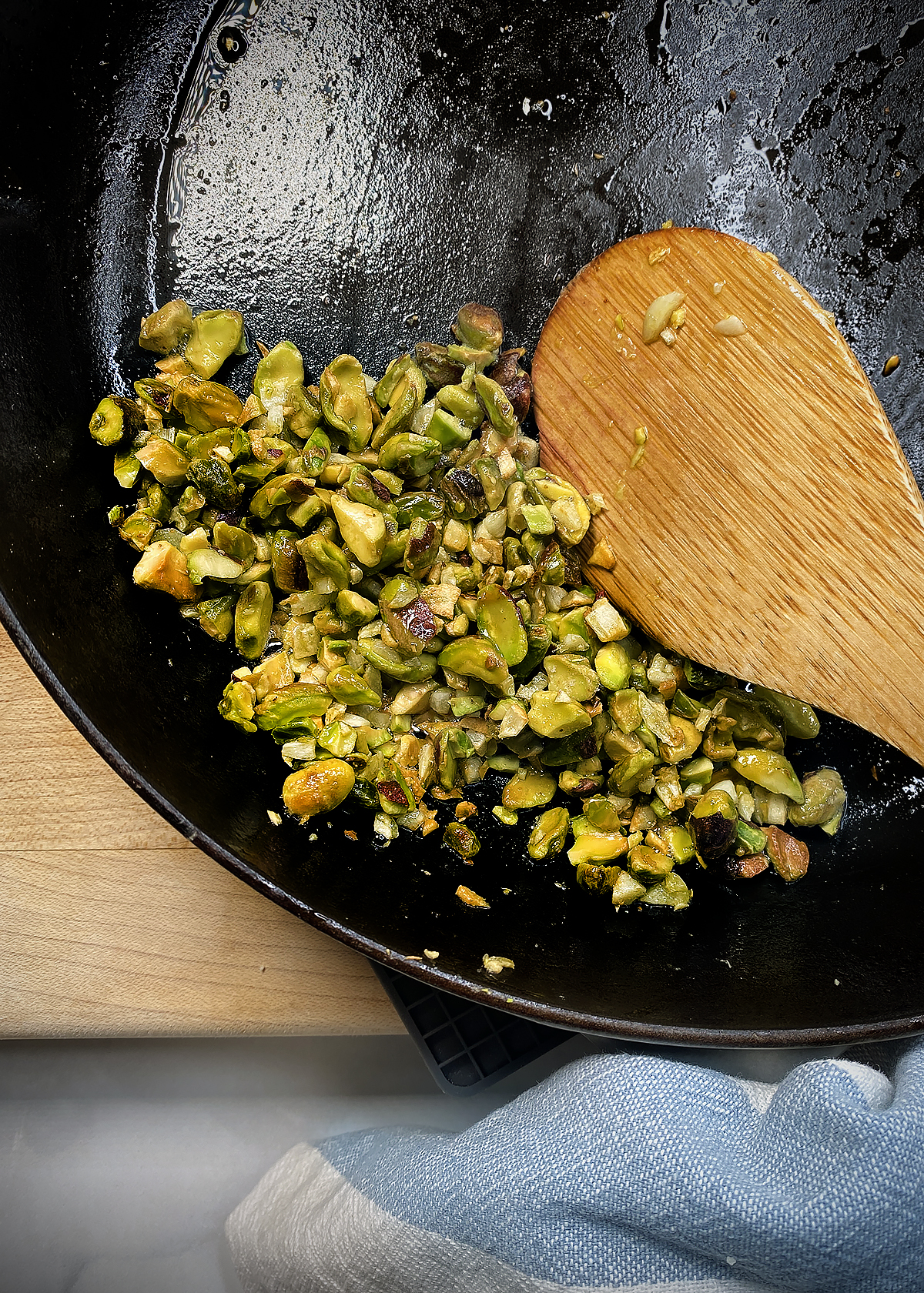 garlic and pistachios sauteed in cast ion skillet