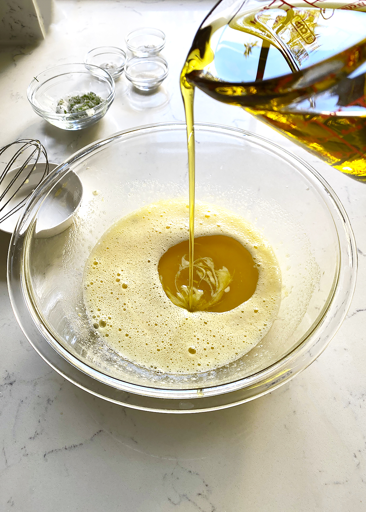 olive oil drizzle into olive oil cake batter