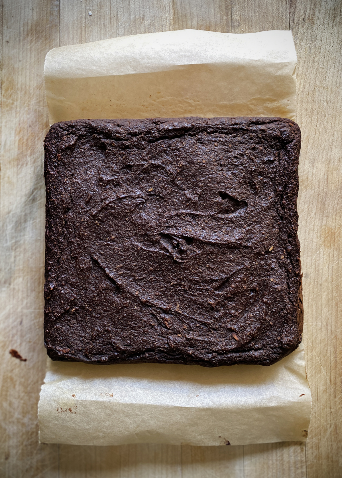 Brownie Baked Oatmeal cooking on parchment