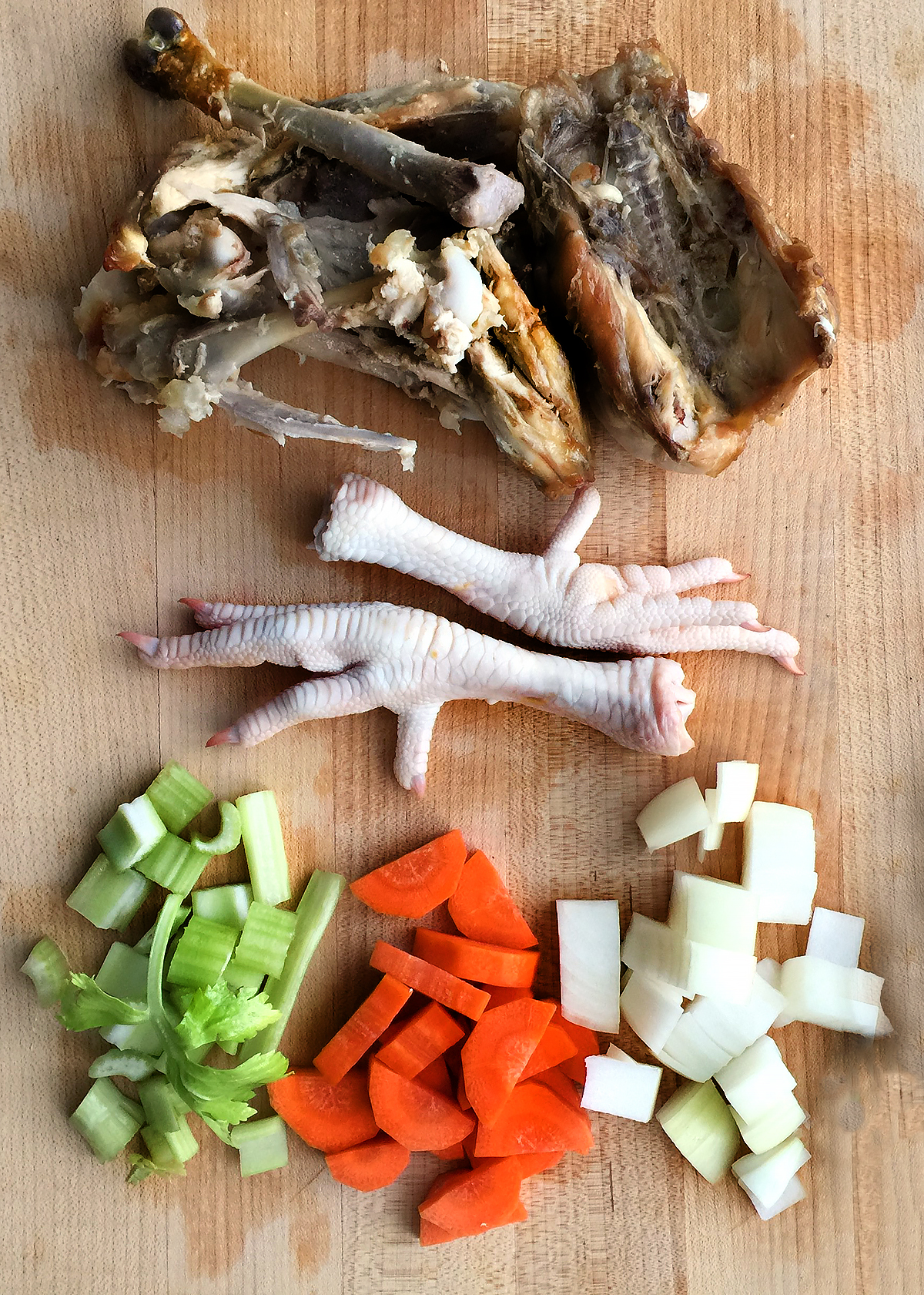 chicken bones, chicken feet, and vegetables for bone broth