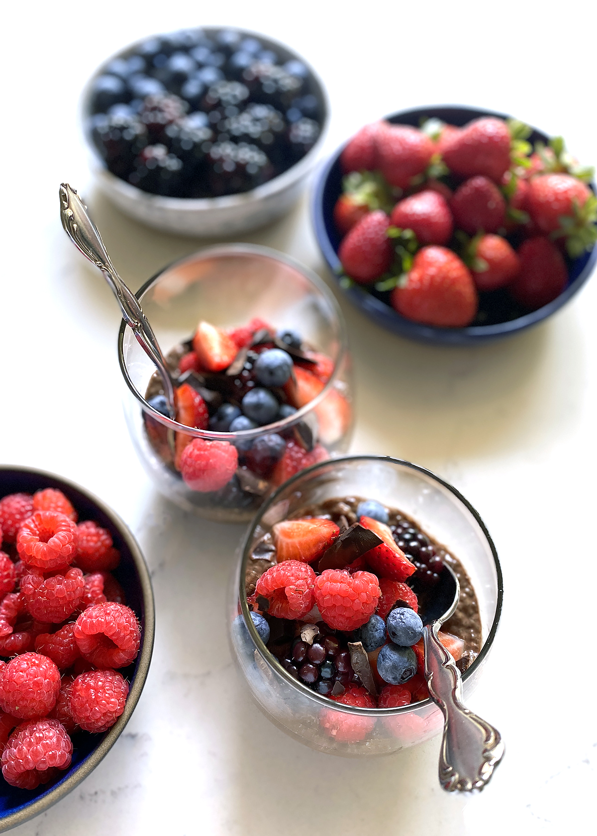 chocolate chia pudding with fruit in cups