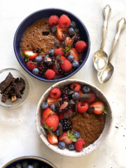 chocolate chia pudding in bowls with fresh berries