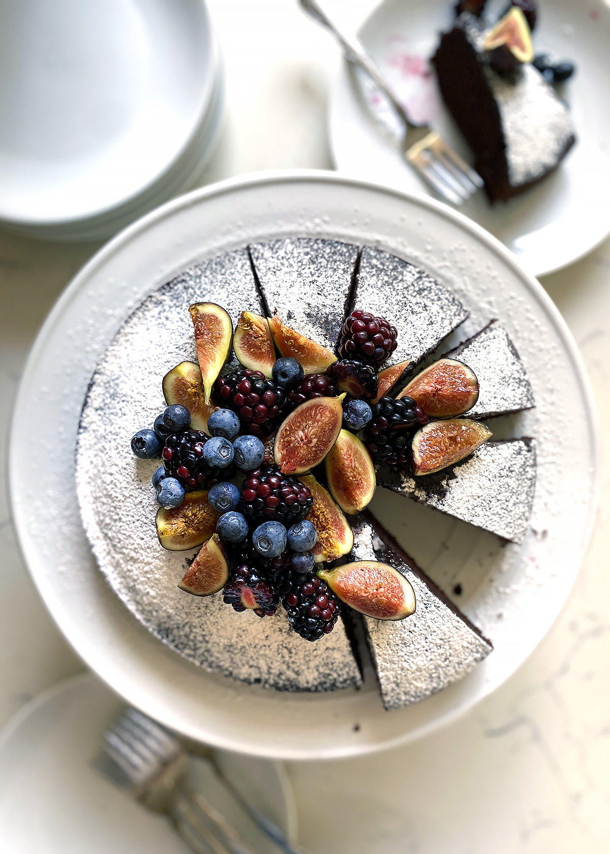 chocolate olive oil cake powdered sugar figs and berries