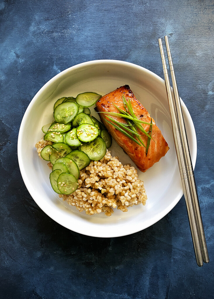 miso salmon with brown rice bowl, blue background