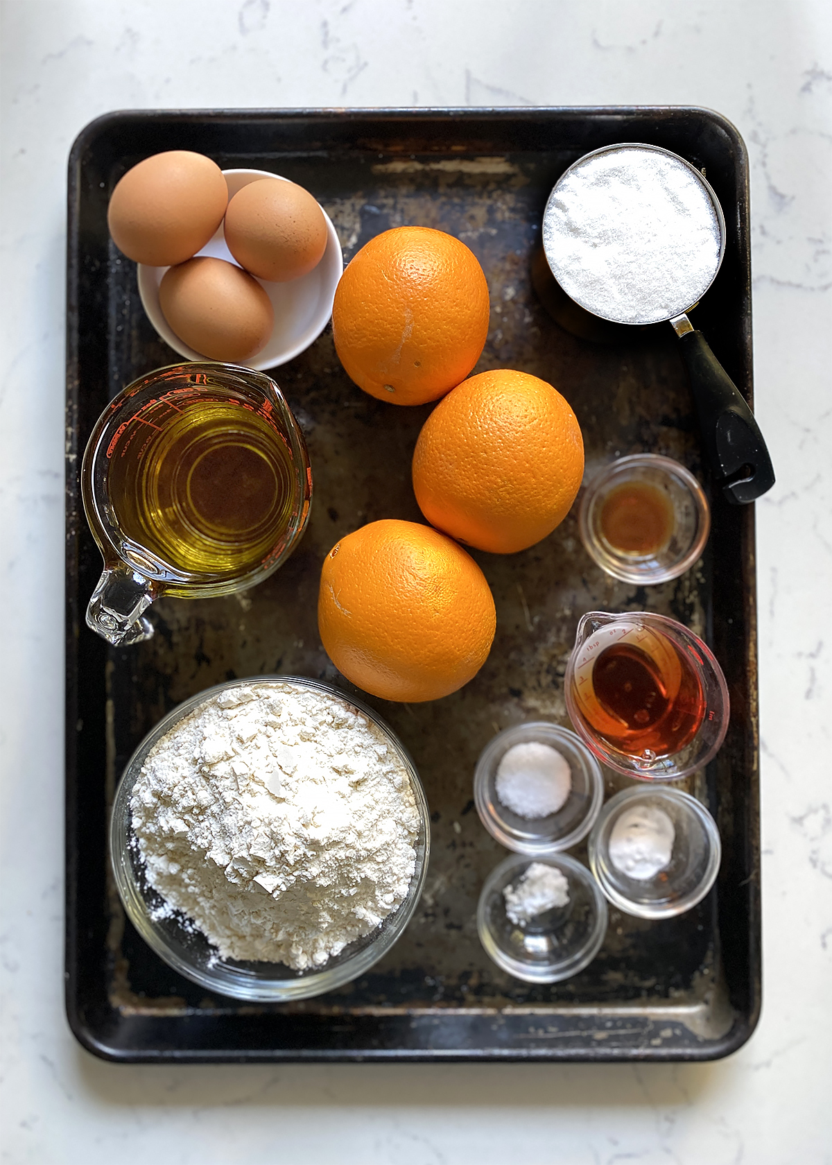 orange olive oil cake ingredients mise en place on tray