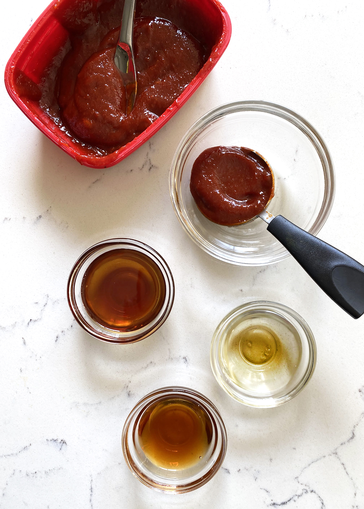 bibimbap sauce ingredients in glass bowls, mise en place