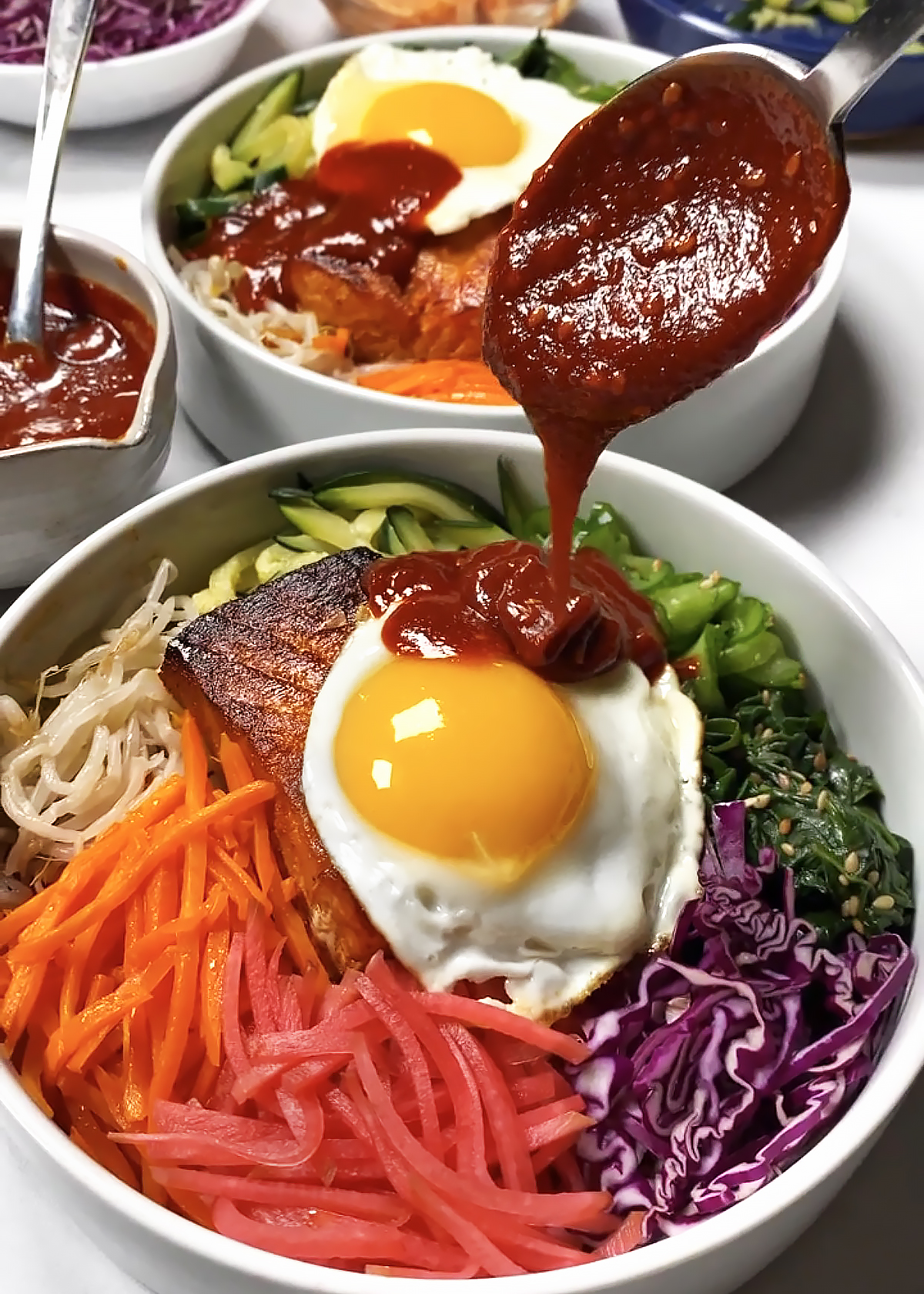 bibimbap sauce drizzle over bibimbap bowl