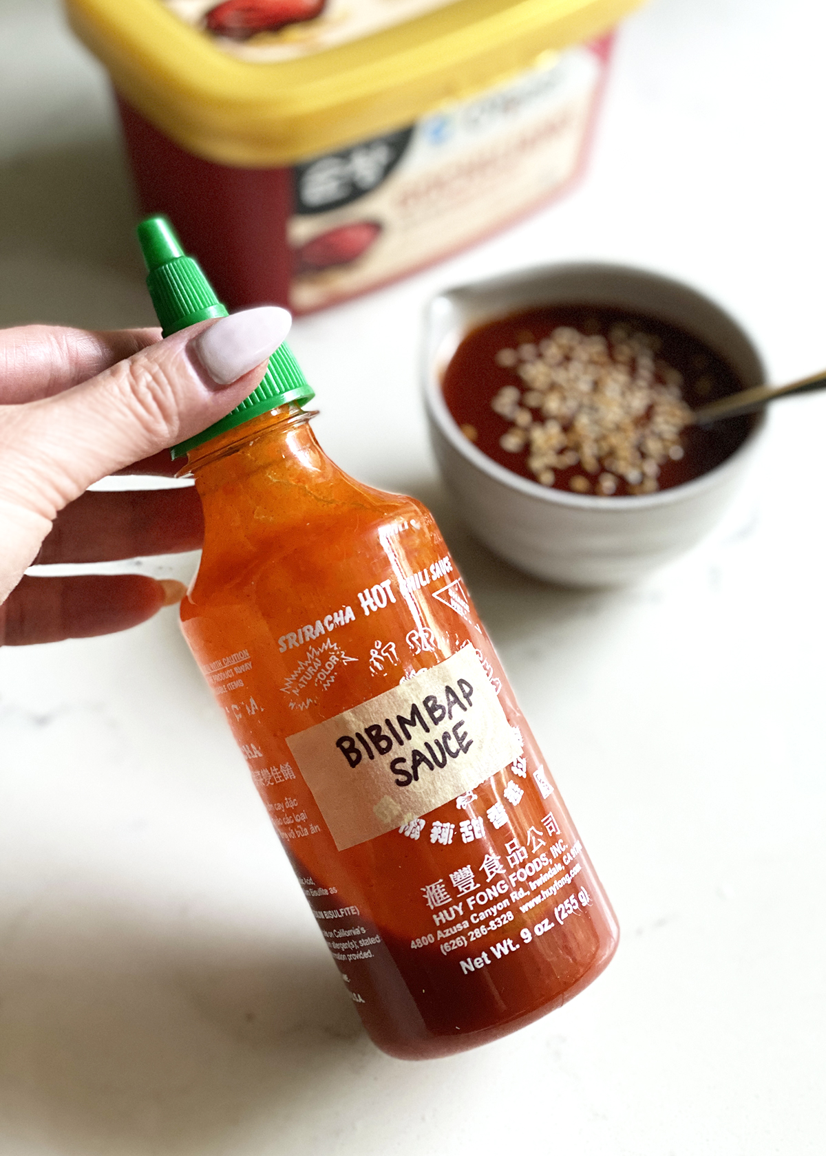 bibimbap sauce in sriracha bottle