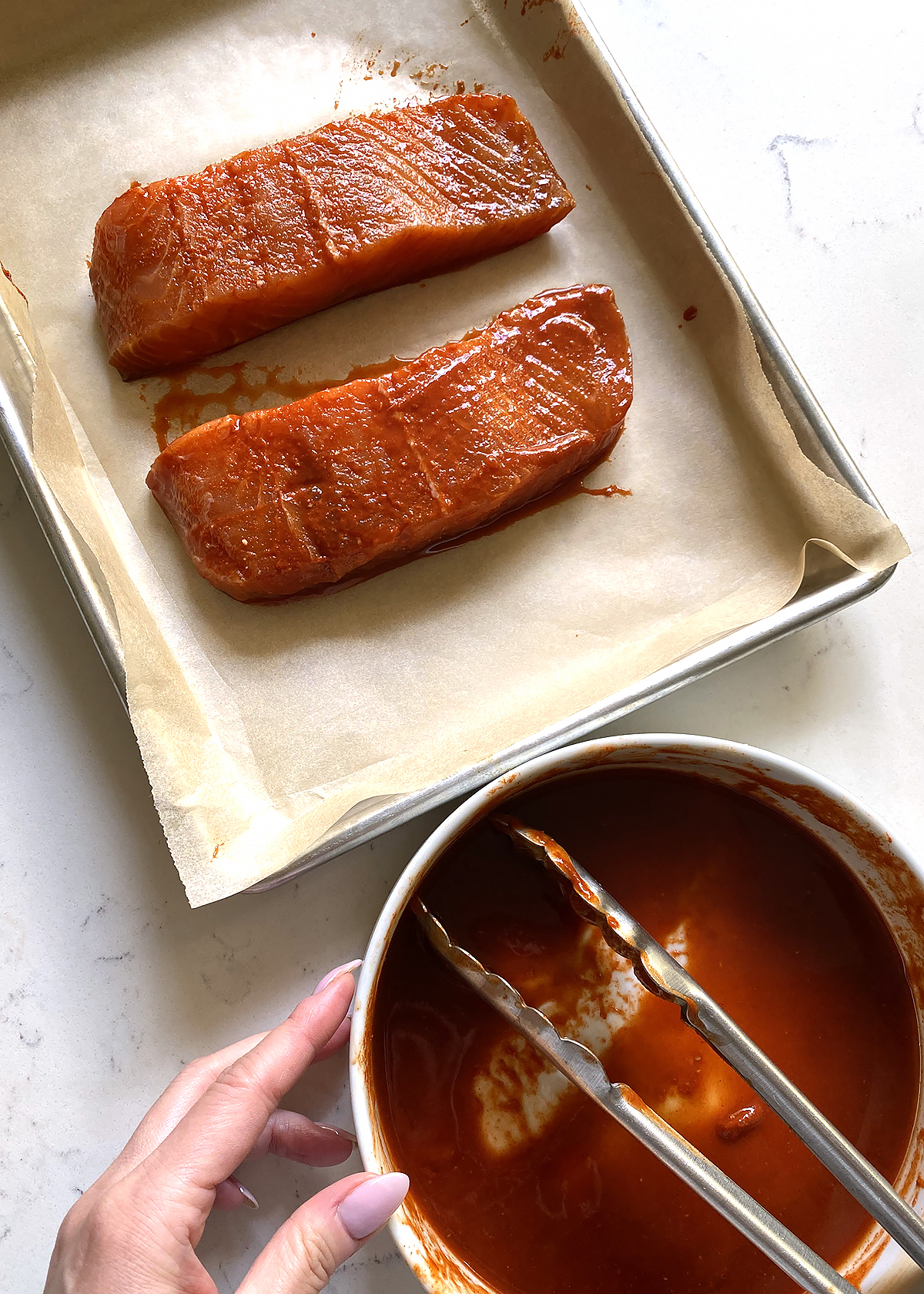 spicy gochujang salmon marinated, on baking sheet