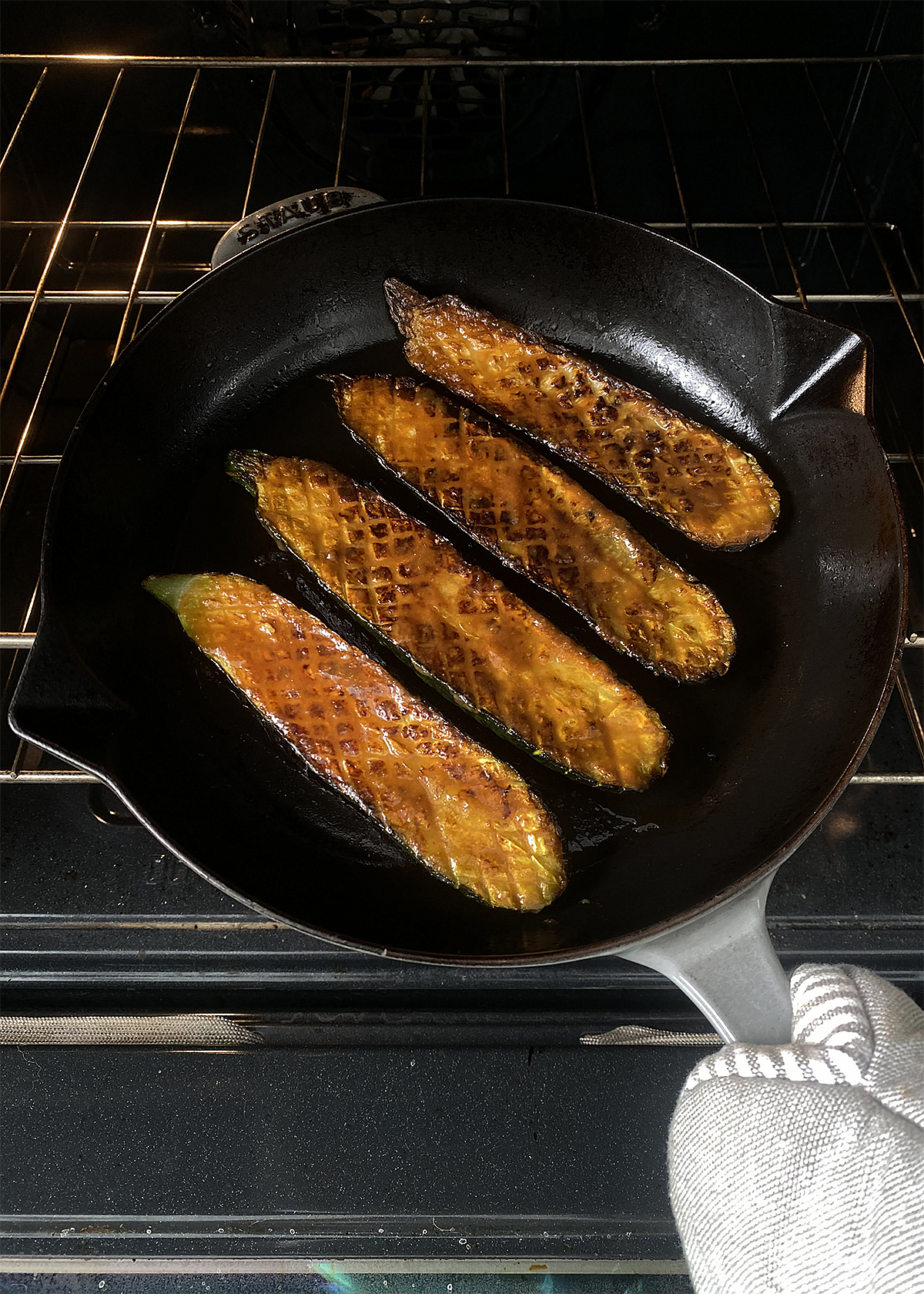 miso glazed zucchini returning to oven under broiler