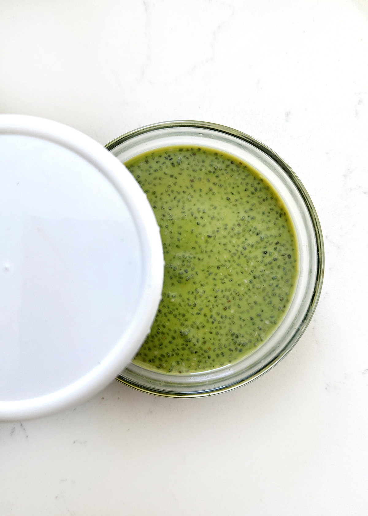 matcha chia seed ingredients in mixing bowl, covered