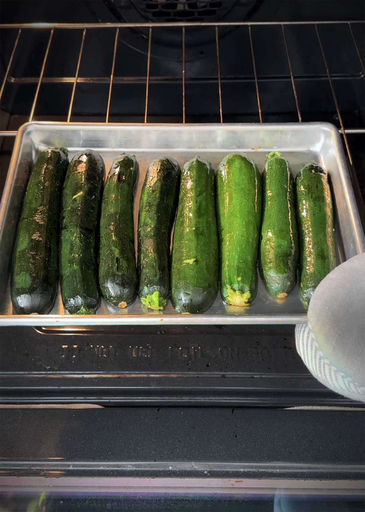 roasted zucchini on sheet pan in oven