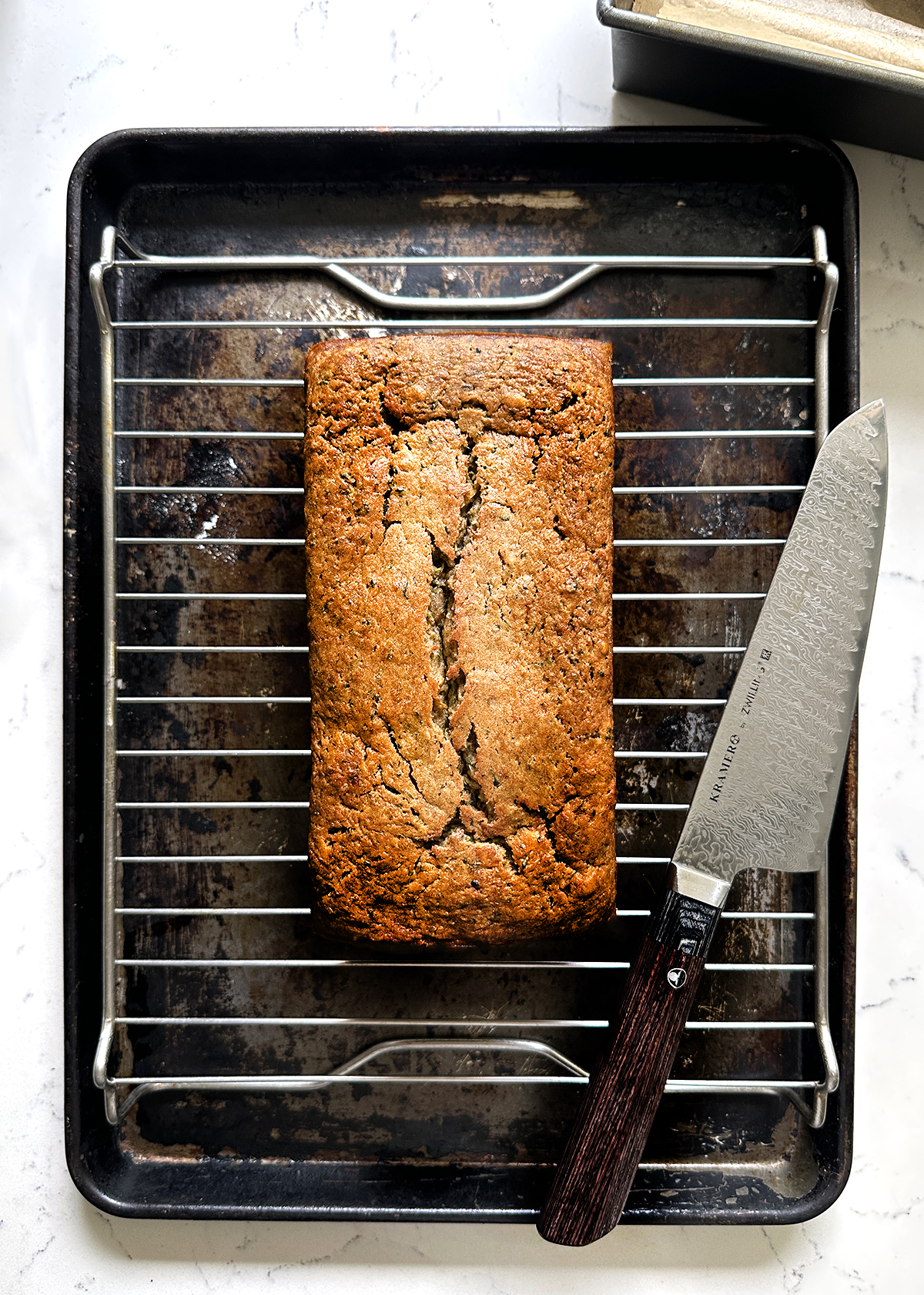 zucchini bread baked loaf on wire cooling rack