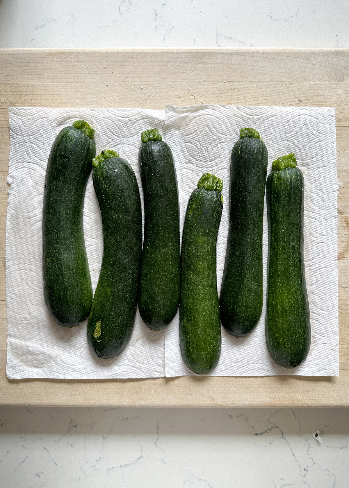 zucchini draining on paper towels