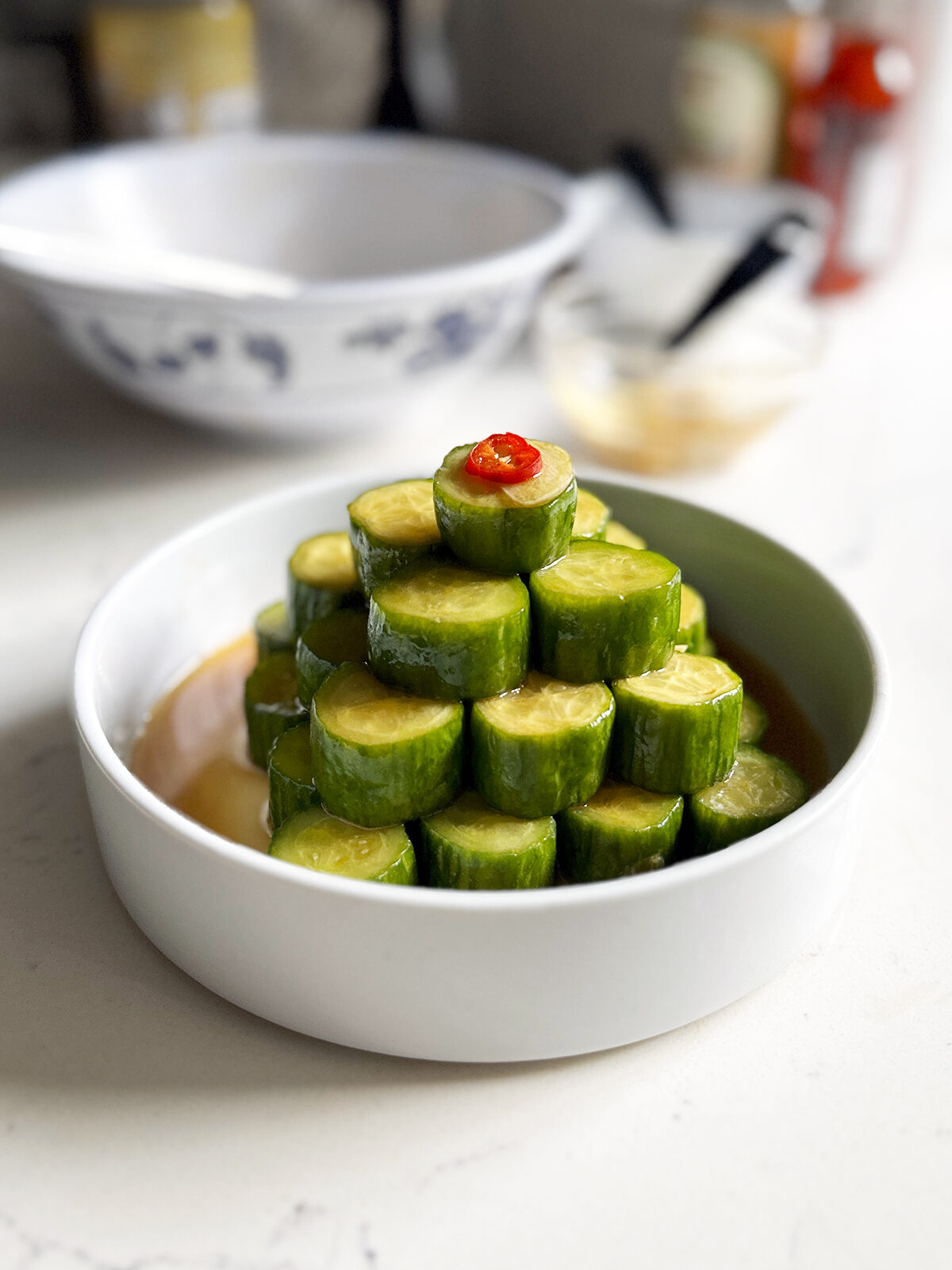 spicy cucumbers slices stacked in bowl