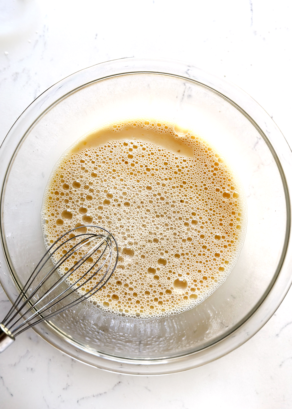 rolled oats and almond milk in mixing bowl