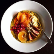 pumpkin spice chia seed pudding in white bowl with fruit toppings