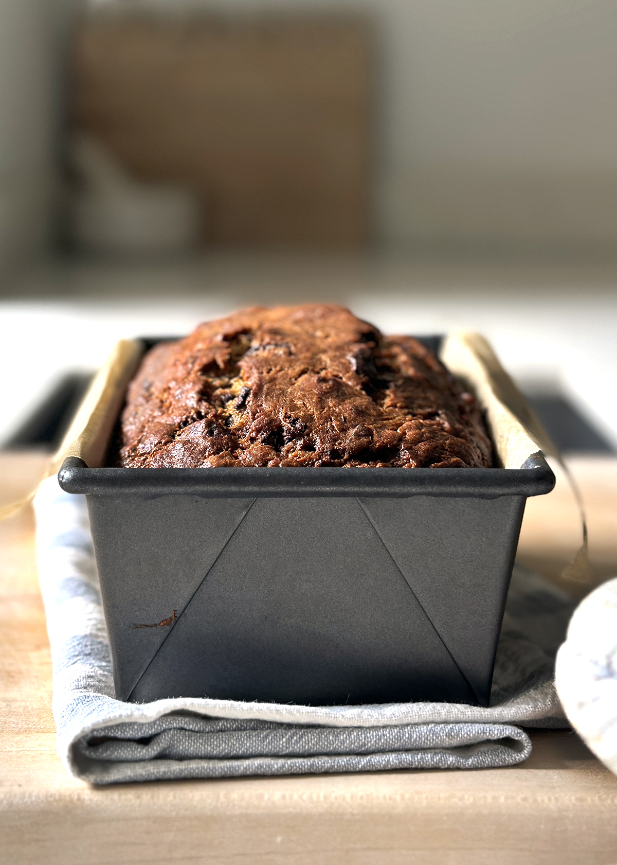 chocolate chip banana bread in loaf pan, cooling