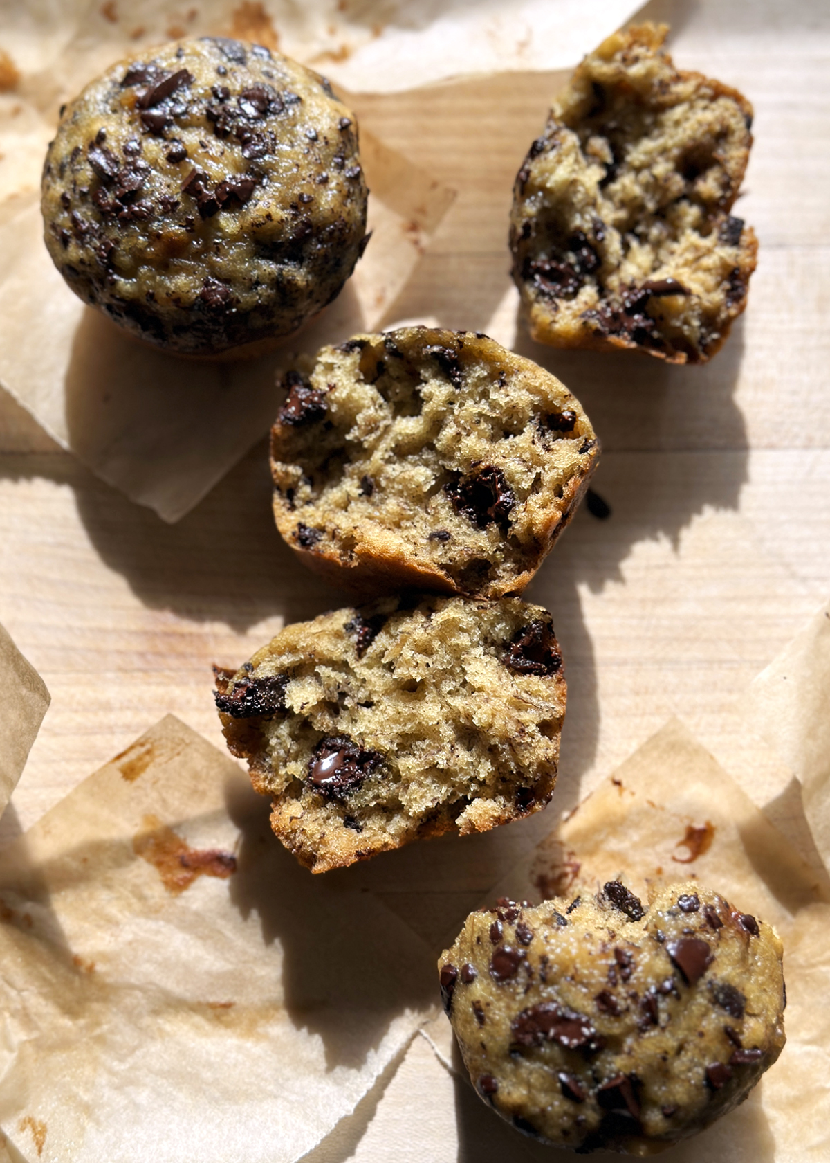 chocolate chip banana bread muffins in paper liner cups