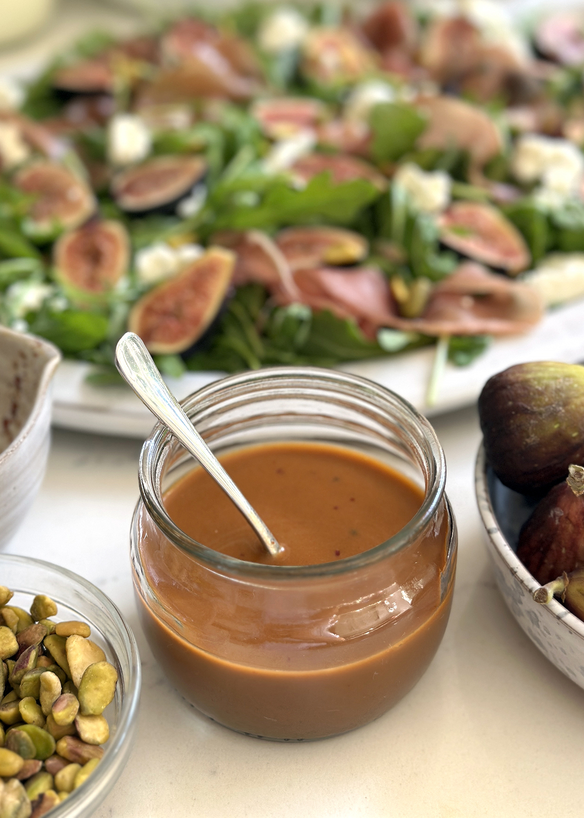 hot honey balsamic vinaigrette dressing in glass bowl on the side