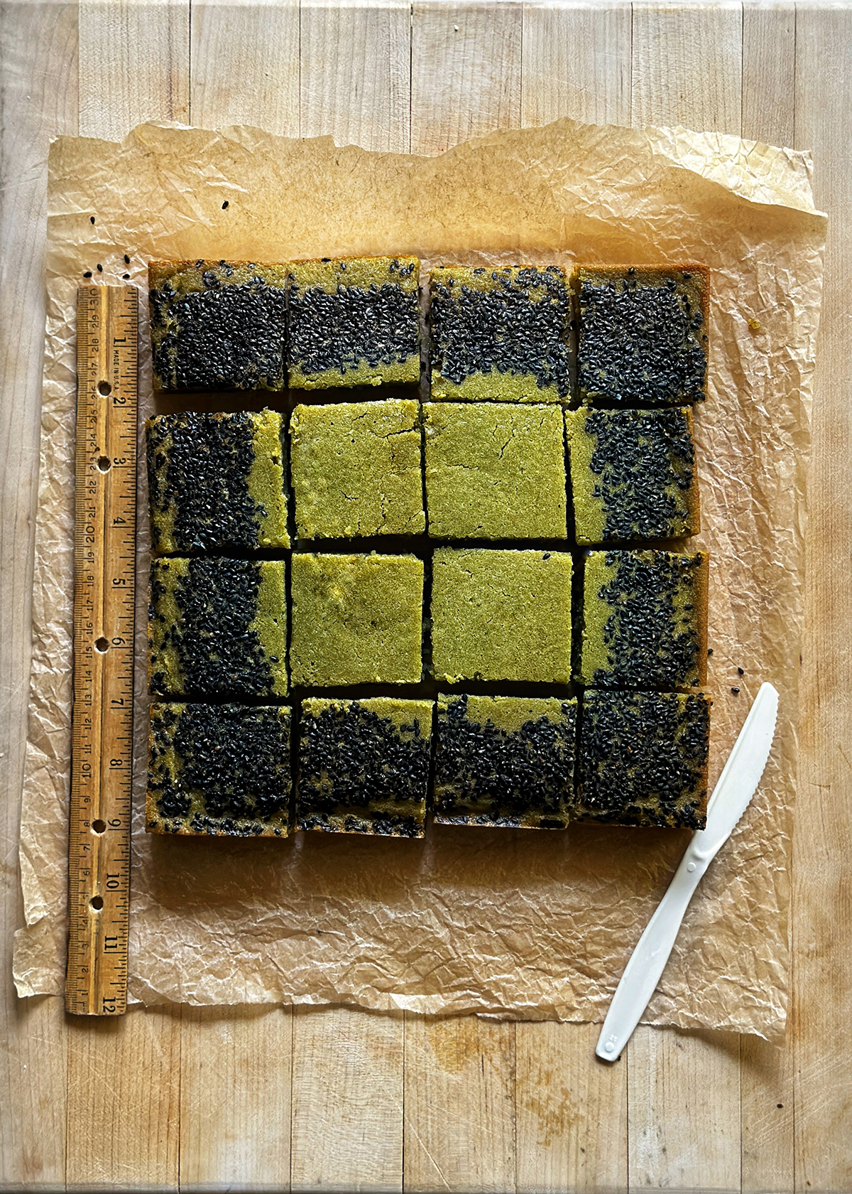 matcha butter mochi on cutting board, sliced