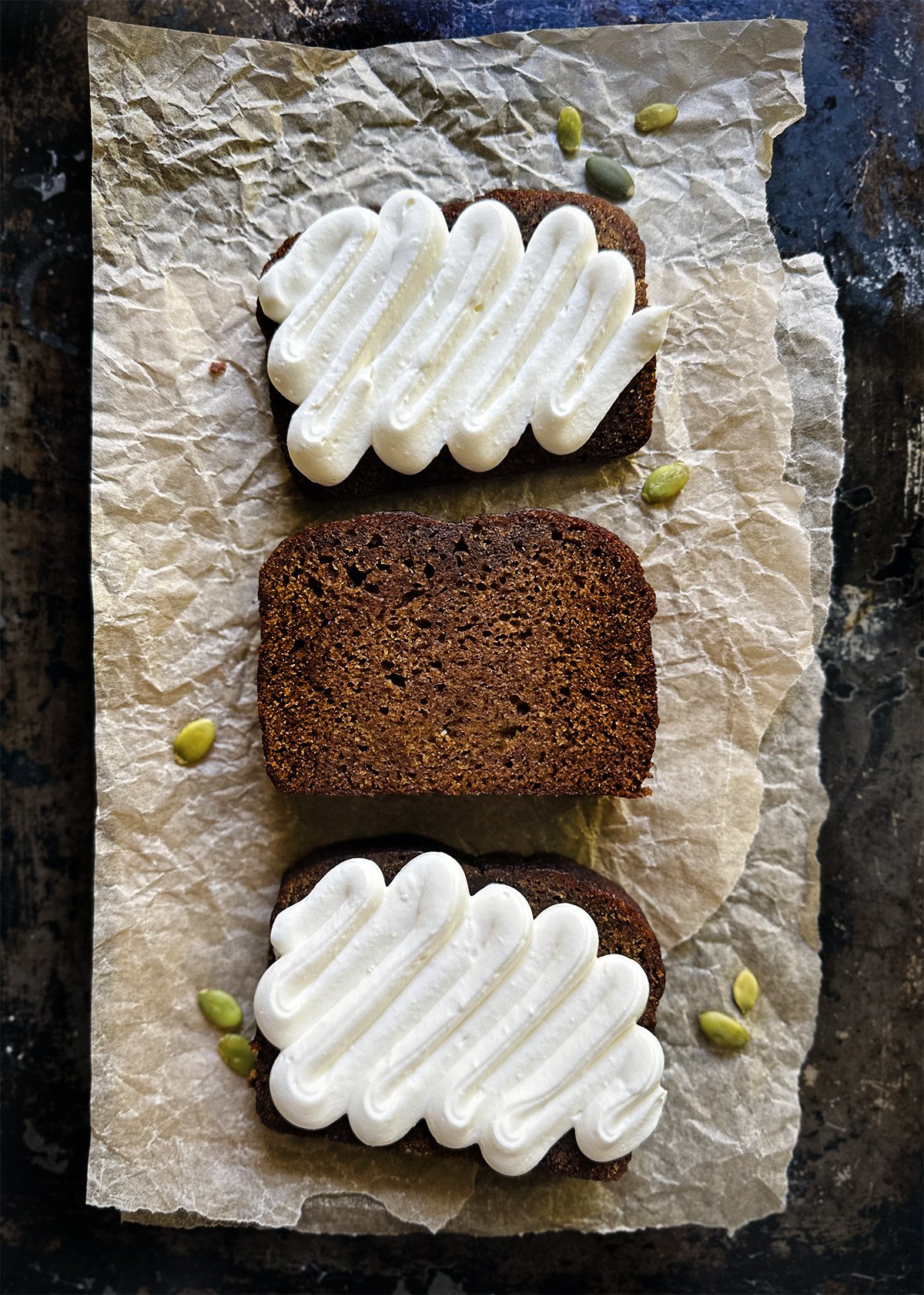 pumpkin bread three slices with whipped ricotta cream cheese