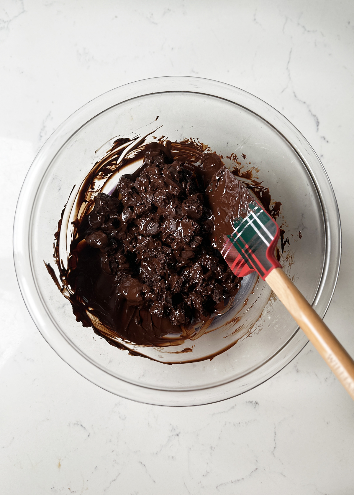 melting dark chocolate in glass mixing bowl