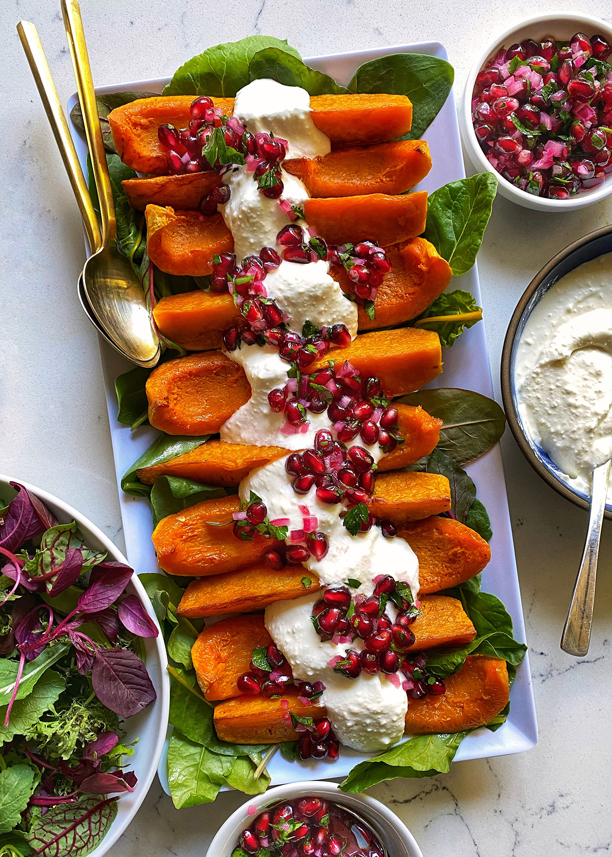 roasted butternut or honeynut squash wedges with feta and pomegranate