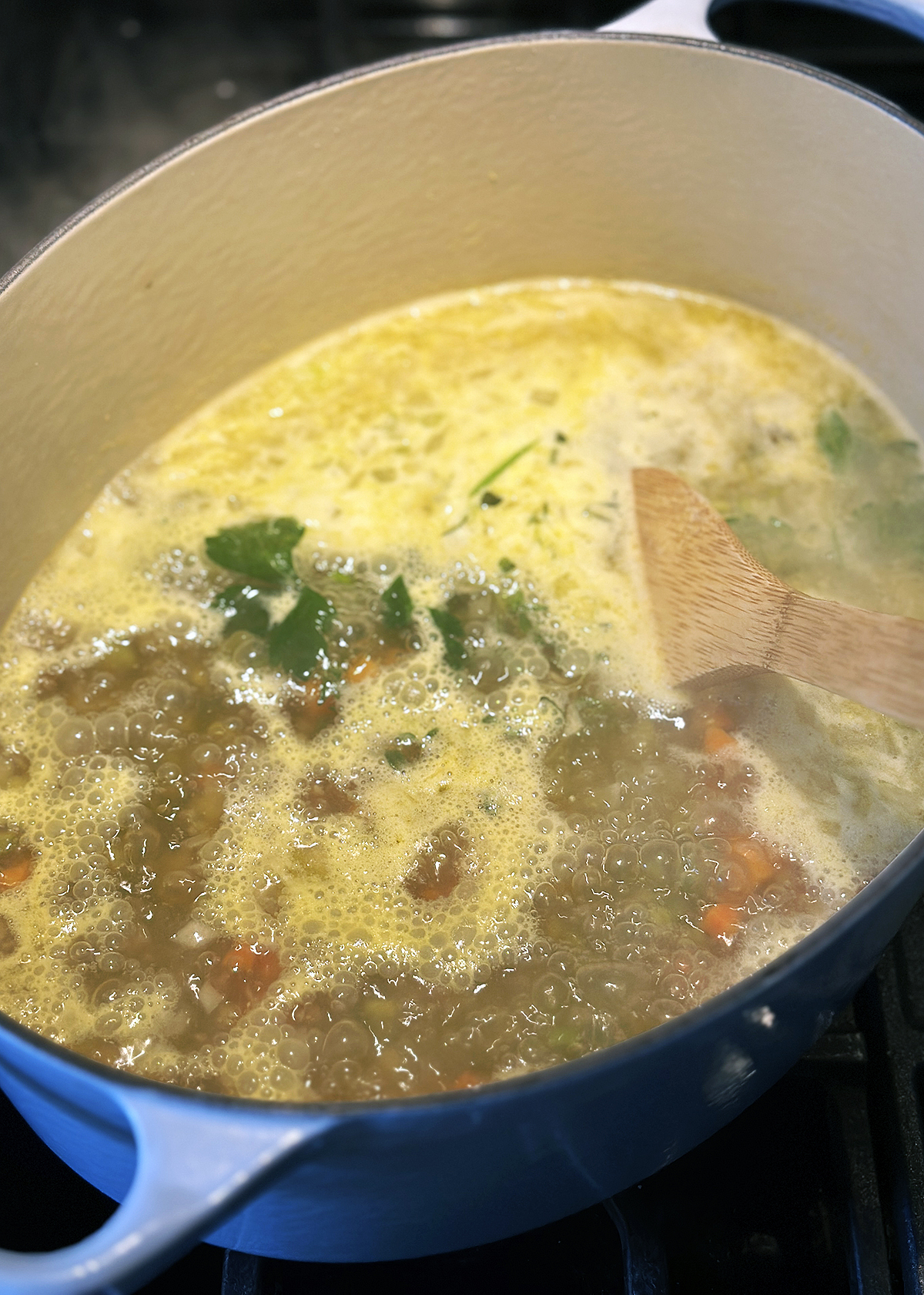 simmering vegetarian split pea soup in pot