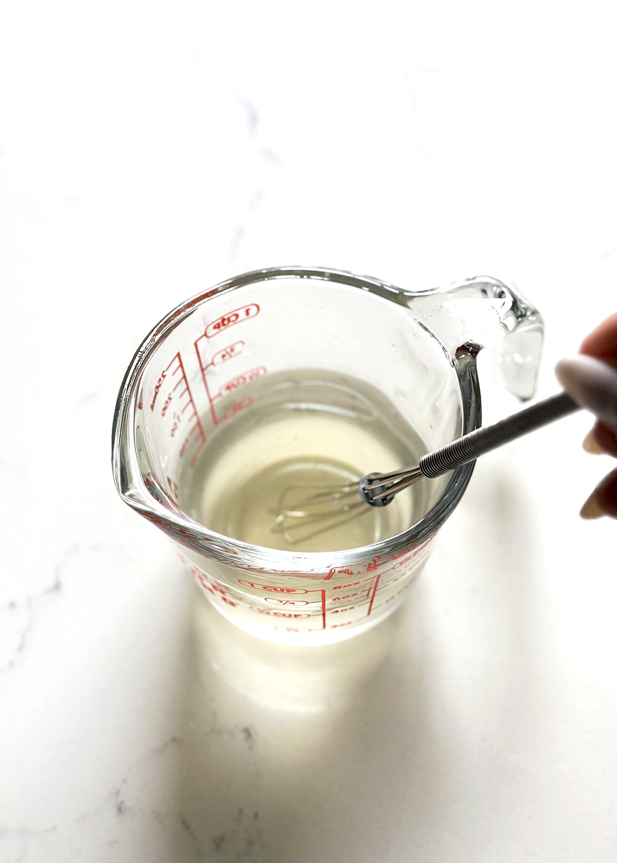 vinegar brine in glass measuring cup