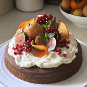 pumpkin olive oil cake with cream cheese frosting and fruit top