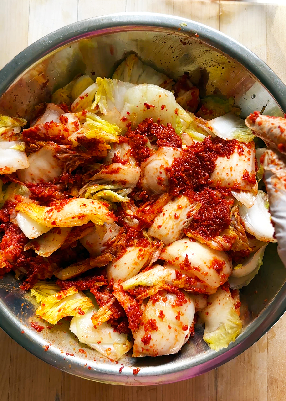 kimchi seasoning mixed into cabbage