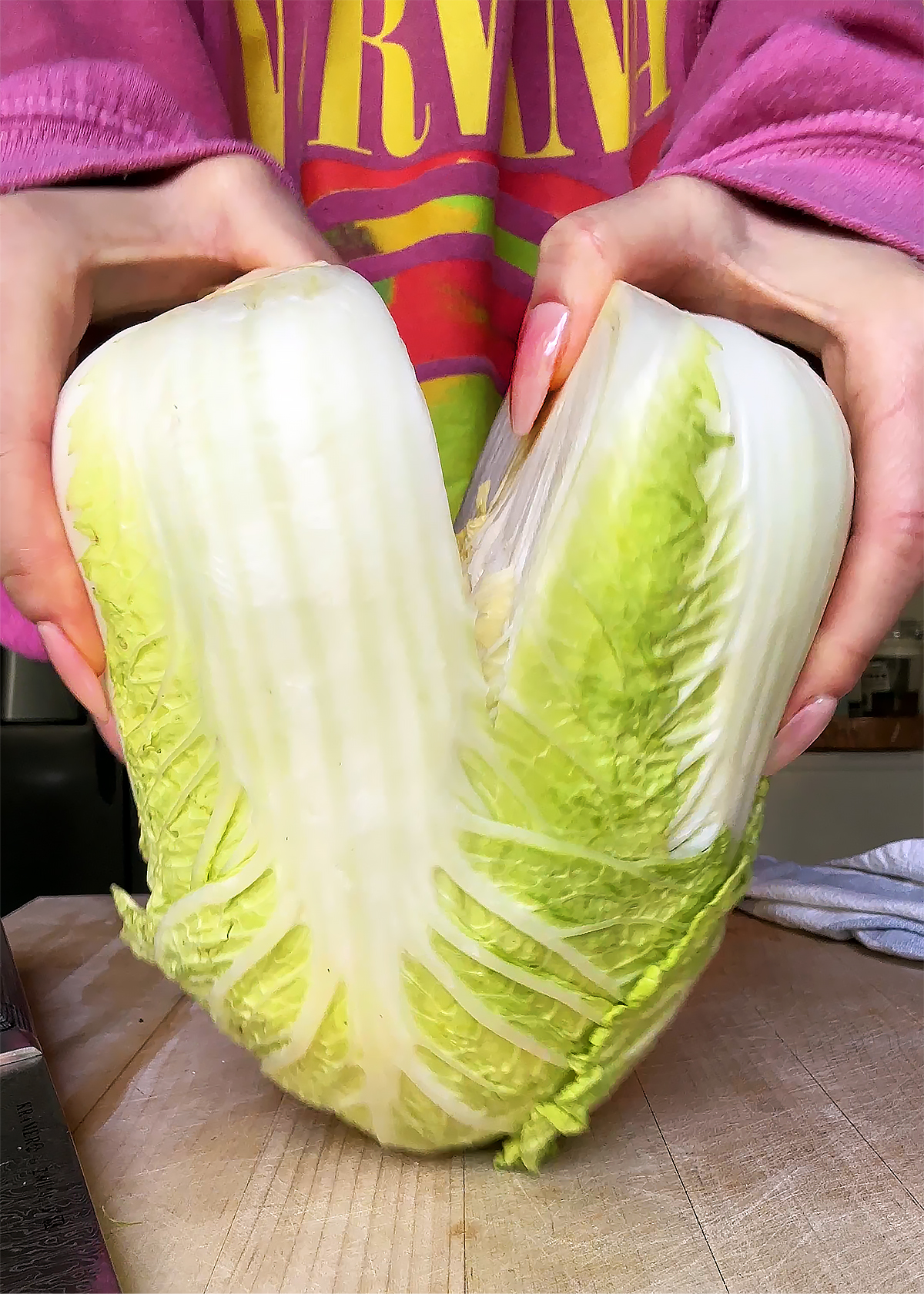 splitting napa cabbage by hand