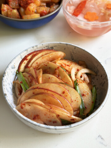 apple kimchi in serving bowl